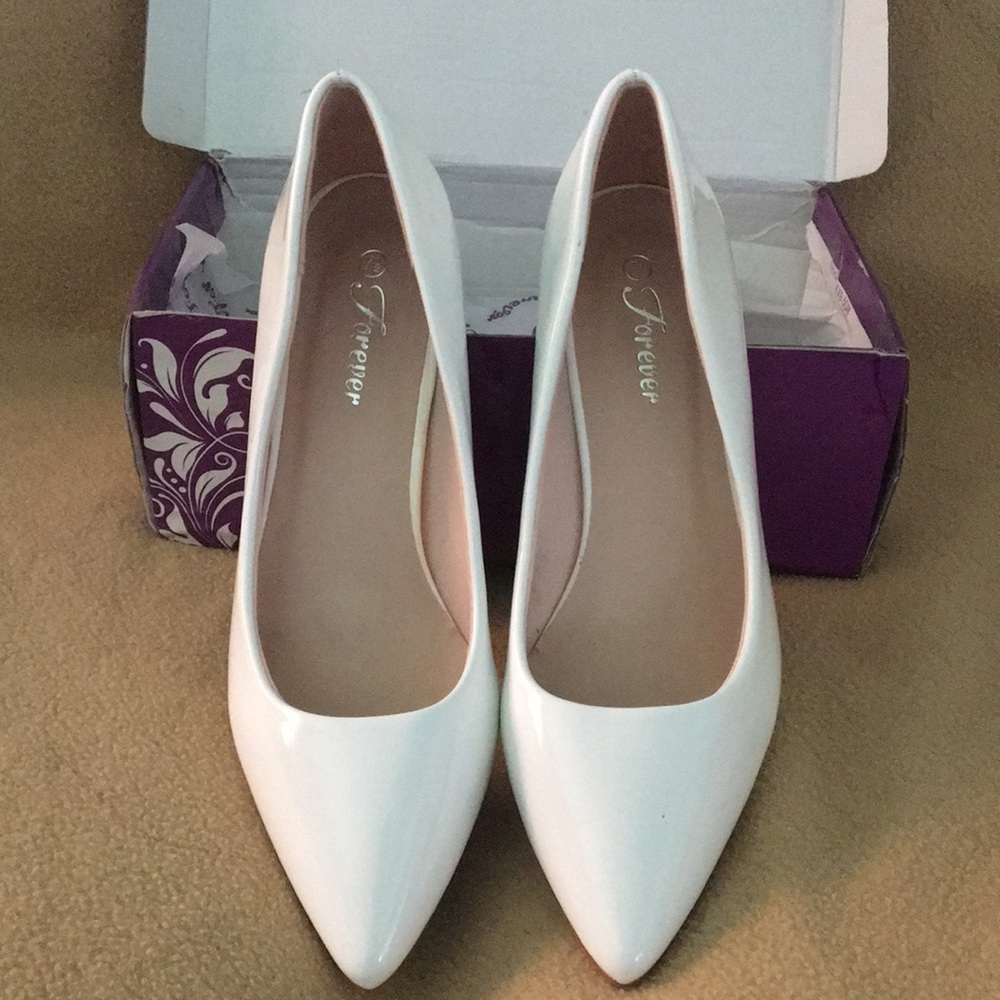 White patent pumps